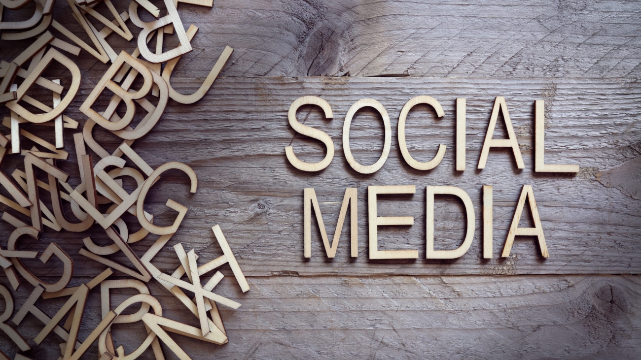 Social media and network concept wood letters on wooden background