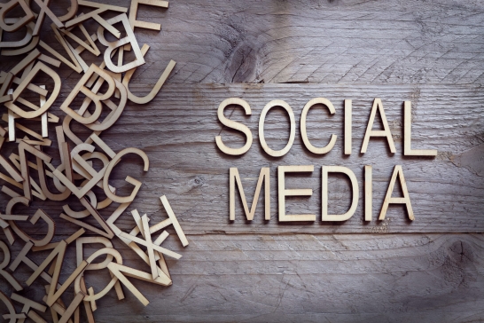 Social media and network concept wood letters on wooden background